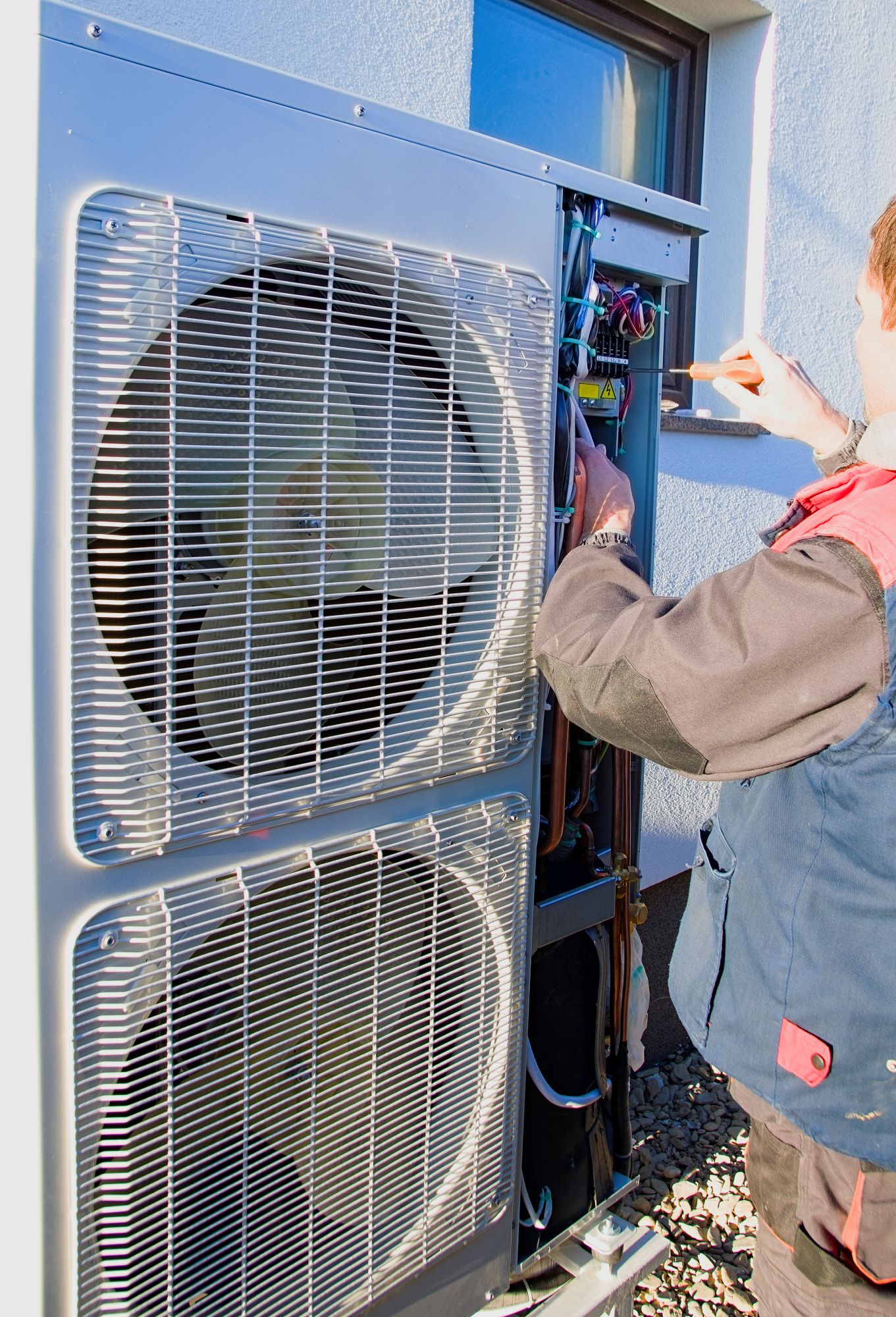Universal Air technician providing HVAC service